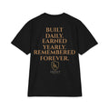 HEAVY WEIGHT T-Shirt — "Built Daily. Earned Yearly. Remembered Forever."